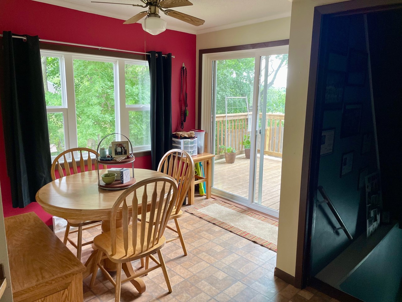 breakfast nook off kitchen with access to deck and backyard