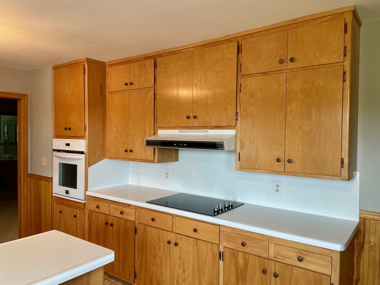 in wall oven and stove top with great counterspace throughout kitchen