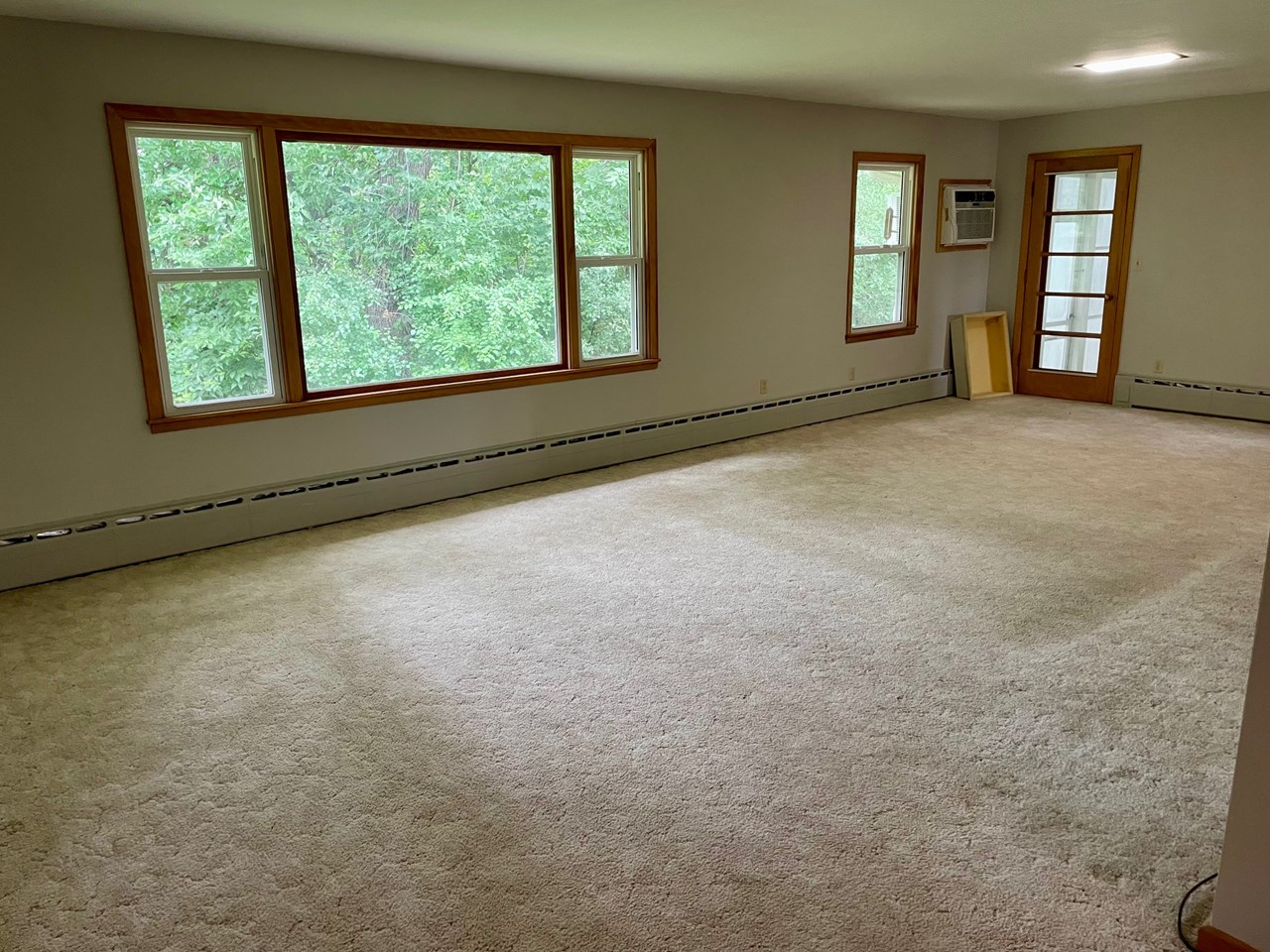 living room and dining room with access to 3 season porch